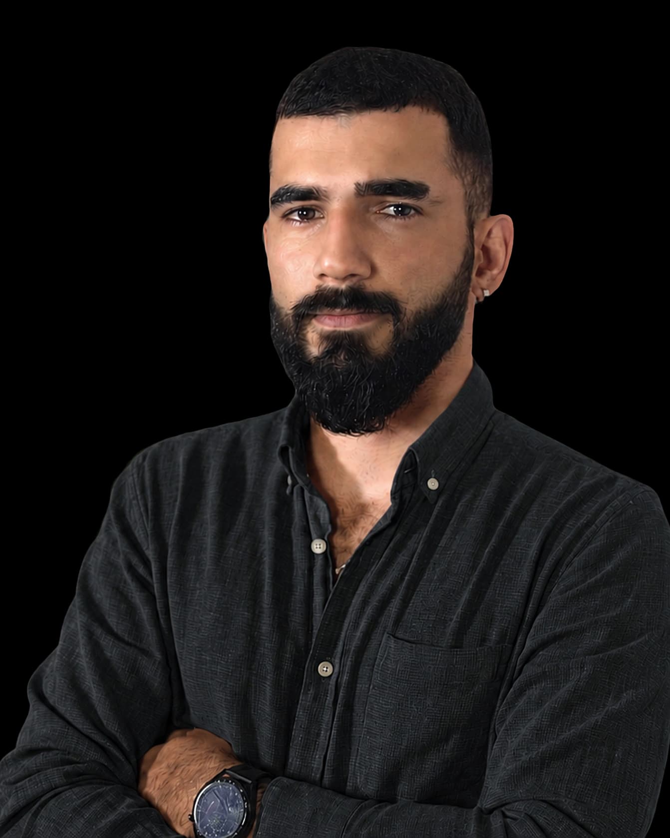Nazim Aghazada, arms folded, lit from behind against a dark background.